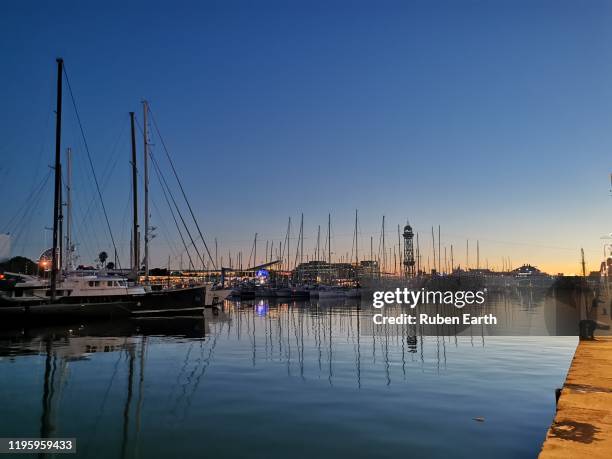 port vell marina at dusk - port de barcelona stock pictures, royalty-free photos & images