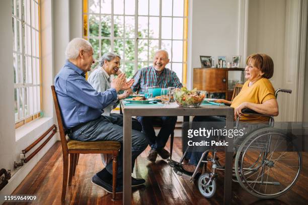 enjoying healthy food and good company - assisted living community stock pictures, royalty-free photos & images