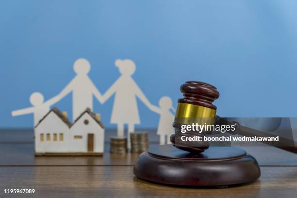 family figure and gavel on table. family law concept - family law stock pictures, royalty-free photos & images