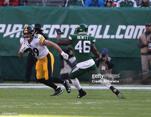 Tight End Vance McDonald of the Pittsburgh Steelers has a long gain against the New York Jets in the first half at MetLife Stadium on December 22,...