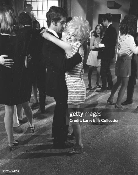 English comedy actress Barbara Windsor films a party scene for the comedy 'Carry on Again Doctor', 1969.