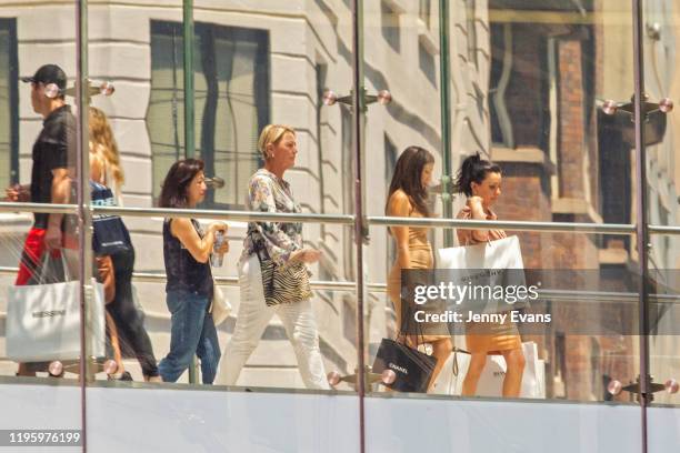 Shoppers are seen in the overpass separating David Jones men's store and Westfield during the Boxing Day sales on December 26, 2019 in Sydney,...