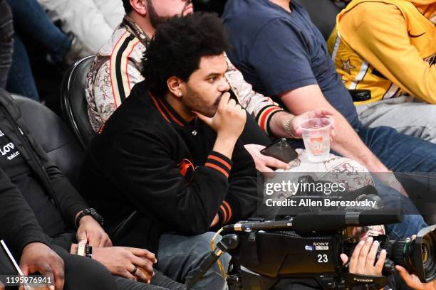 Recording artist The Weekend attends a basketball game between the Los Angeles Lakers and the Los Angeles Clippers at Staples Center on December 25,...