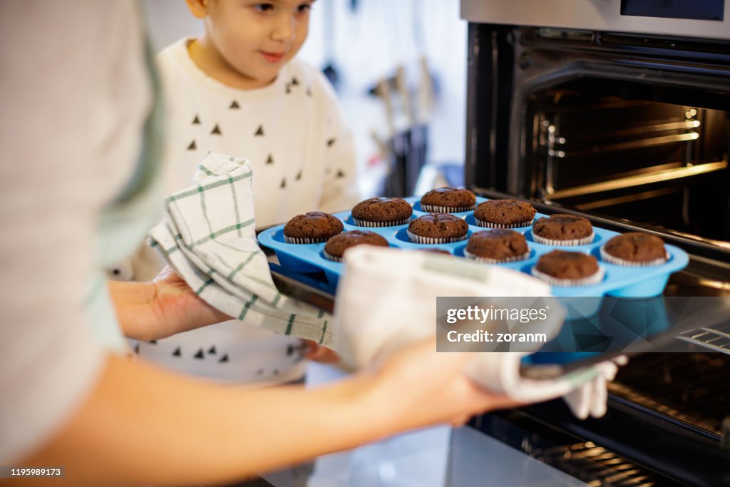 Mother baking muffins