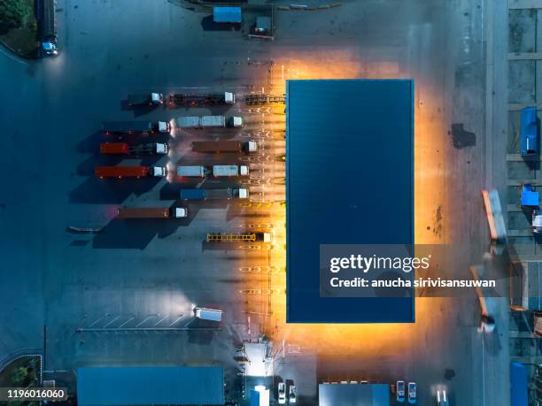 transport station container trainer products at night. - shipyard aerial stock pictures, royalty-free photos & images