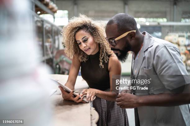 engineer and manager using tablet and working in the factory - production line worker stock pictures, royalty-free photos & images