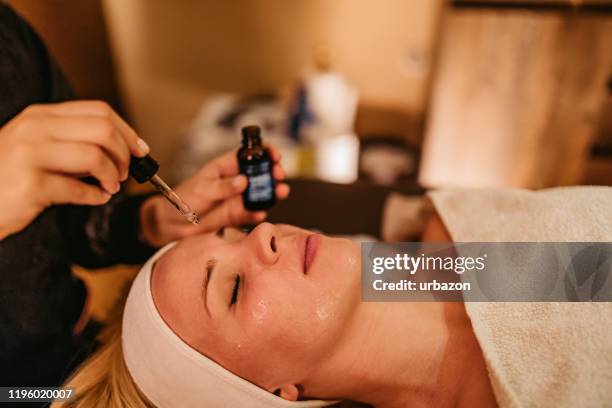 woman head massage with aromatherapy - forehead stock pictures, royalty-free photos & images