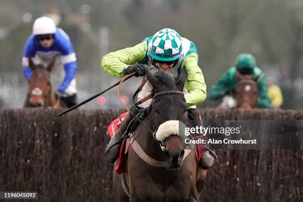 Sam Twiston-Davies riding Clan Des Obeaux clear the last to win The Ladbrokes King George VI Chase at Kempton Park Racecourse on December 26, 2019 in...