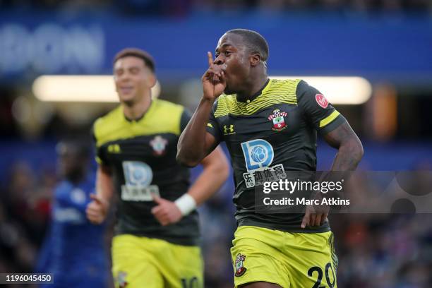 Michael Obafemi of Southampton celebrates after scoring his team's first goal during the Premier League match between Chelsea FC and Southampton FC...