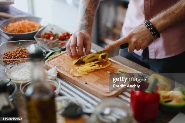 chef cutting paprika - fajitas stock pictures, royalty-free photos & images