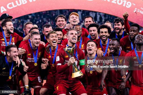 Liverpool FC celebrating with his trophy of champions during the FIFA Club World Cup Final match between Liverpool FC and CR Flamengo at Khalifa...