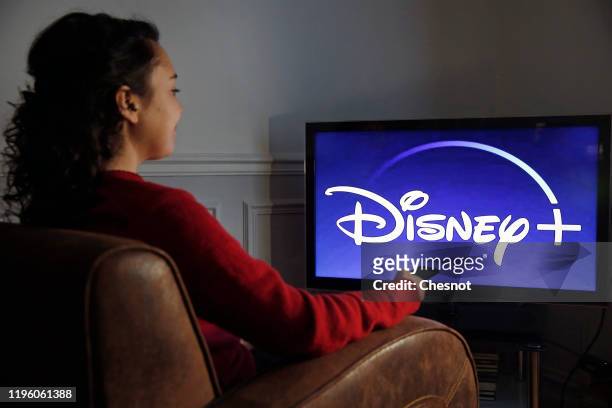 In this photo illustration, the Disney + logo is displayed on the screen of a TV on December 26, 2019 in Paris, France. The Walt Disney Company...