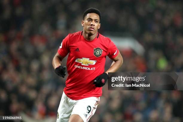 Anthony Martial of Manchester United celebrates scoring his team's fourth goal during the Premier League match between Manchester United and...