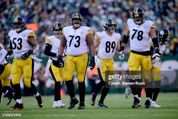 Maurkice Pouncey, Ramon Foster, Vance McDonald and Alejandro Villanueva of the Pittsburgh Steelers line up for the play against the New York Jets at...