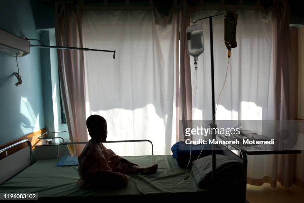 chemo with cancer in child patient concept - sad child hospital stock pictures, royalty-free photos & images