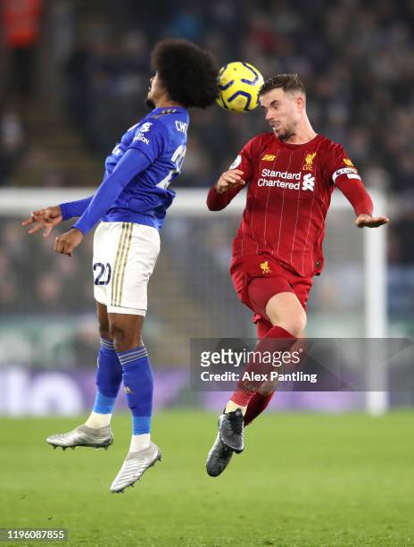 Jordan Henderson of Liverpool and Hamza Choudhury of Leicester City battle for a header during the Premier League match between Leicester City and...
