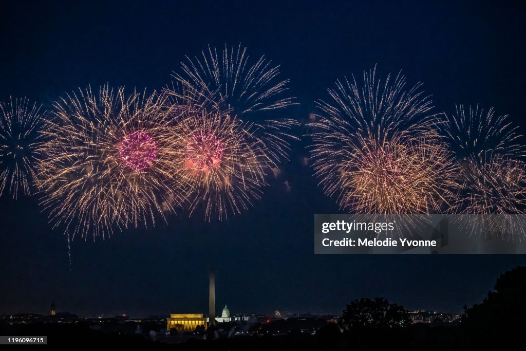 Horizontal color image of view from Arlington Ridge Park of White House and memorials in Washington DC surrounded by fireworks