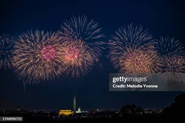 horizontal color image of view from arlington ridge park of white house and memorials in washington dc surrounded by fireworks - washington dc summer stock pictures, royalty-free photos & images