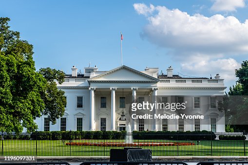 Horizontal color photo of White House in Washington DC on a bright summer day