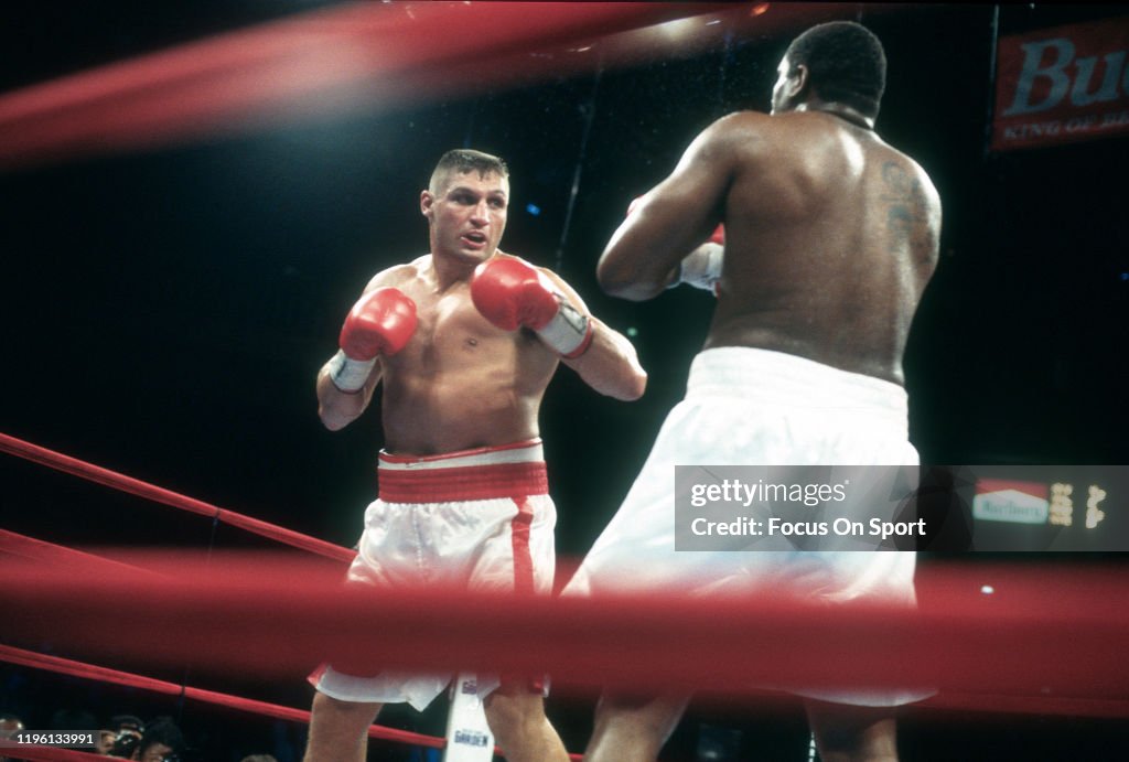 Riddick Bowe and Andrew Golota fights in a heavy weight match on July ...