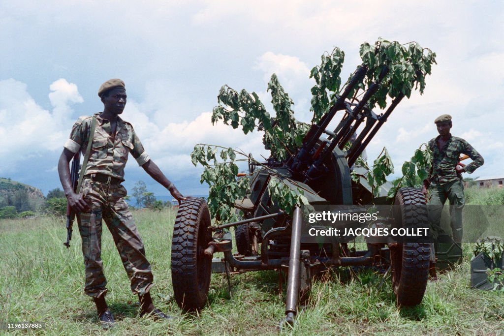 Ww1 Rwanda Rwandan rebel soldiers stand near an anti-aircraft gun they captured ...