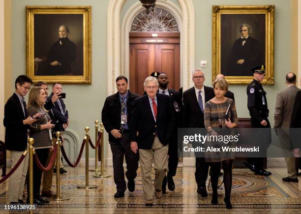 Senate Majority Leader Sen. Mitch McConnell walks to his office before the Senate impeachment trial against President Donald Trump on January 25,...