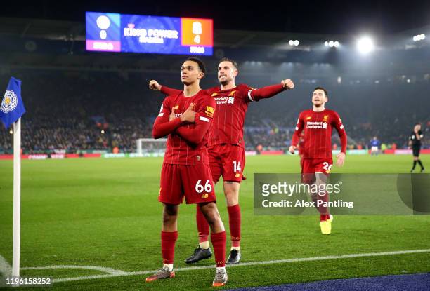 Trent Alexander-Arnold of Liverpool celebrates scoring his sides fourth goal with Jordan Henderson and Andy Robertson during the Premier League match...
