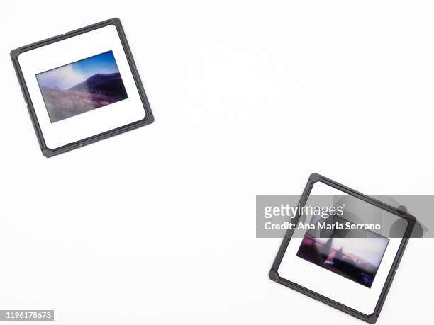 close-up of photographic slides on a white background - diams stock-fotos und bilder