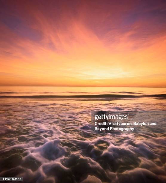 foamy water against sunset at fort myers beach, florida - gulf of mexico stock pictures, royalty-free photos & images