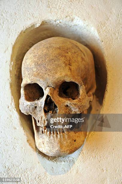 Picture taken on July 20, 2011 at the museum Henri Prades in the southern city of Lattes, a human skull placed in a portico during the "Rites and...