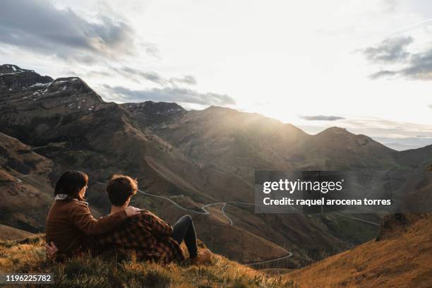 young couple in the mountains during sunset - cantabria stockfoto's en -beelden