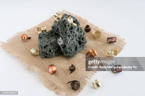 soft coal pieces on jute sack over white background. typical spanish candy of three wise men day. copy space. - la befana fotografías e imágenes de stock