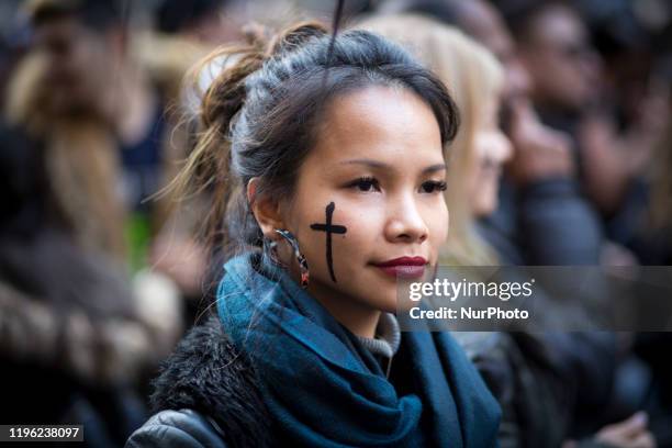 Girl is portrayed with the sign of the cross on her cheek in Rome, on January 25, 2020. A thousand of people took part in a demonstration in defense...