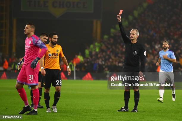 Ederson of Manchester City is sent off by referee Martin Atkinson during the Premier League match between Wolverhampton Wanderers and Manchester City...