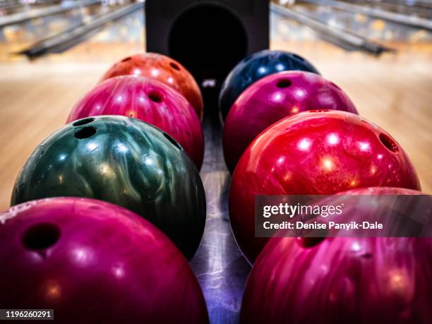 brightly colored bowling balls - bowler hat stock-fotos und bilder