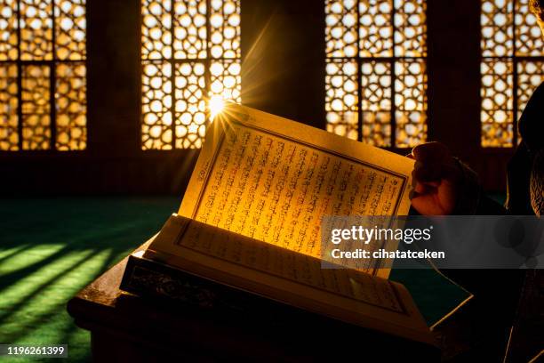 quran in the mosque - koran stock pictures, royalty-free photos & images