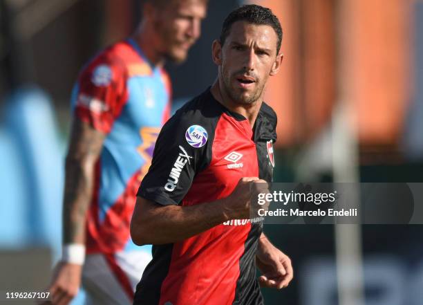 Maximiliano Rodriguez of Newells celebrates after scoring the first goal of his team during a match between Arsenal and Newell's Old Boys as part of...