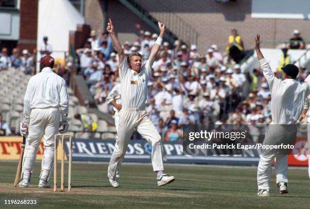 Dominic Cork of England traps West Indies batsman Junior Murray LBW for 0, the second wicket of his hat-trick, during the 4th Test match between...