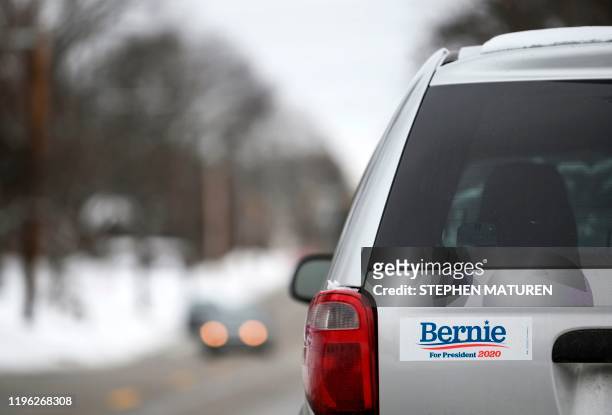 Bumper sticker endorsing Democratic presidential candidate Sen. Bernie Sanders decorates a vehicle parked in Des Moines, Iowa on January 25, 2020. -...