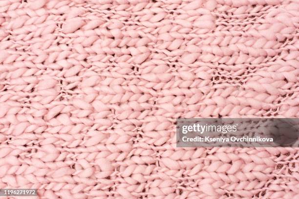 pink knitted fabric background. color image. - knitted stock pictures, royalty-free photos & images