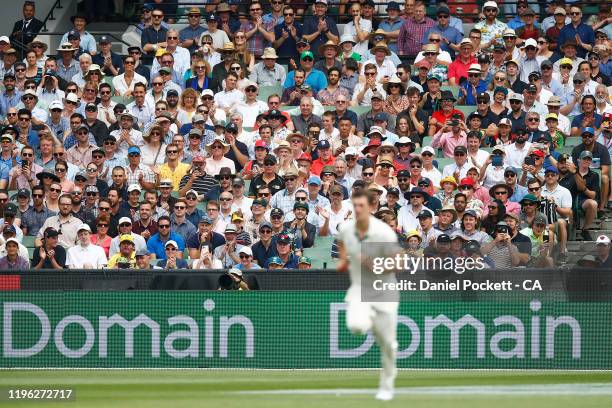 Fans clap for Pat Cummins of Australia as he comes in to bowl for a hat-trick during day three of the Second Test match in the series between...