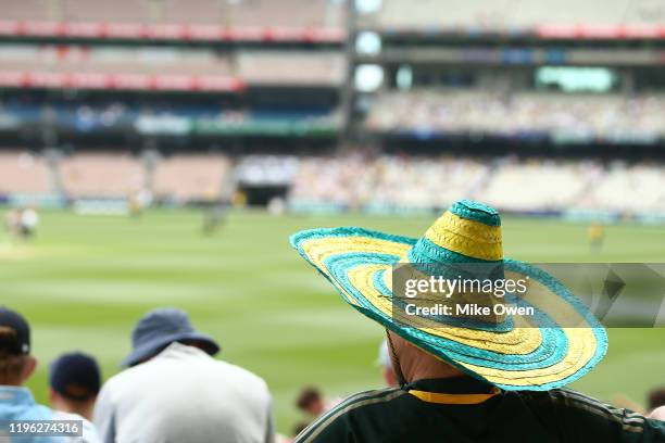 An Australian fan enjoys the atmosphere during day three of the Second Test match in the series between Australia and New Zealand at Melbourne...