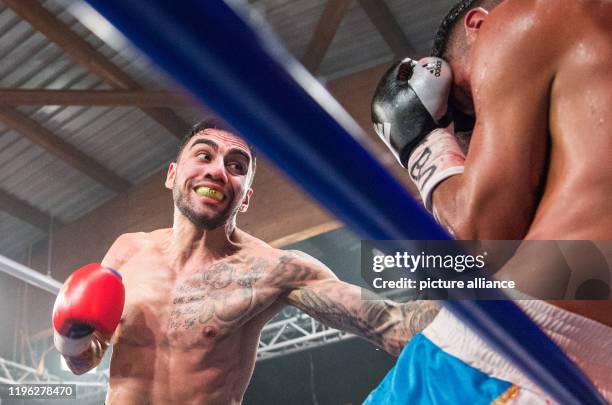 January 2020, Hamburg: Boxing: Professionals, International fight evening at Universum Gym. Artem Harutyunyan from Germany fights against Miguel...