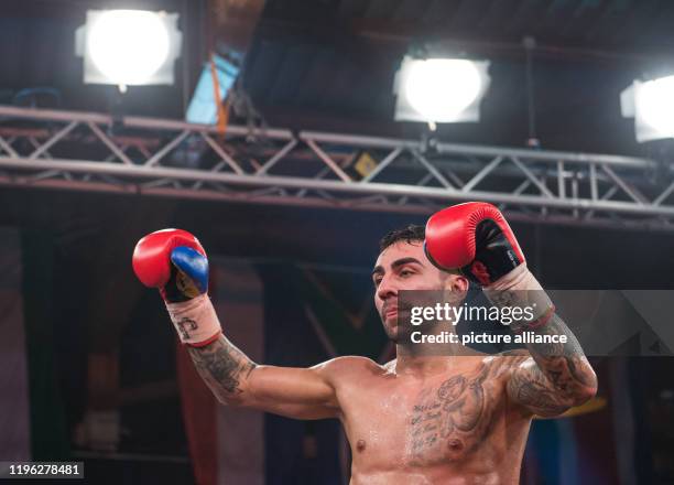 January 2020, Hamburg: Boxing: Professionals, International fight evening at Universum Gym. Artem Harutyunyan from Germany cheers after his victory...