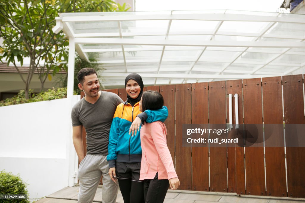 Asian family having fun doing sports