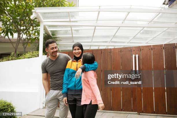 asian family having fun doing sports - malay archipelago stock pictures, royalty-free photos & images