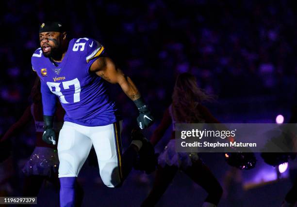 Everson Griffen of the Minnesota Vikings takes the field during player introductions before the game against the Green Bay Packers at U.S. Bank...