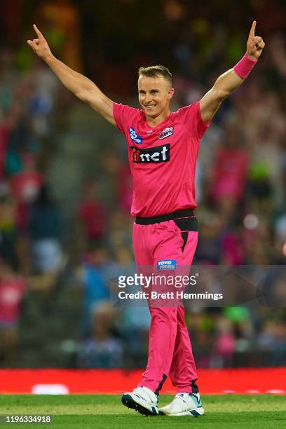 Tom Curran of the Sixers celebrates victory in the super over during the Big Bash League match between the Sydney Sixers and the Sydney Thunder at...