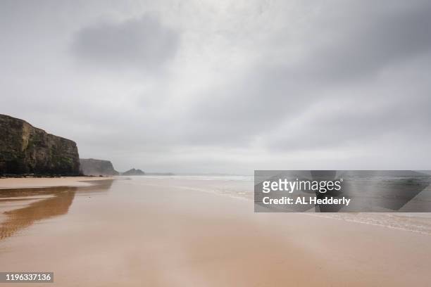 watergate bay beach - overcast beach stock pictures, royalty-free photos & images