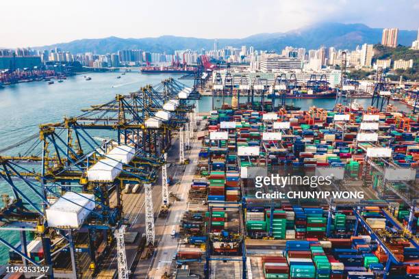 commercial logistics industry. the containers is loaded / unloaded at kwai tsing container terminals of hong kong - global trade war stock pictures, royalty-free photos & images